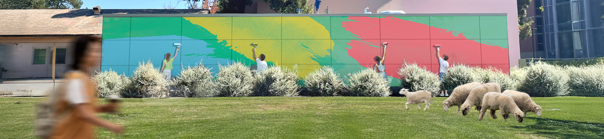 Five people paint colorful streaks of green, yellow, teal, and red on a large mural panel mounted on an outdoor wall. In the foreground, four sheep graze on a grassy lawn while a student walks by, slightly blurred, holding a coffee. Shrubs line the base of the wall, and campus buildings are visible in the background.